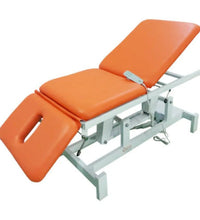 Orange therapy table on a white background