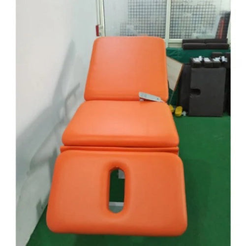Orange therapy table on a white background
