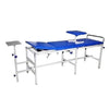 Medical examination table with blue surface and metal frame on a white background